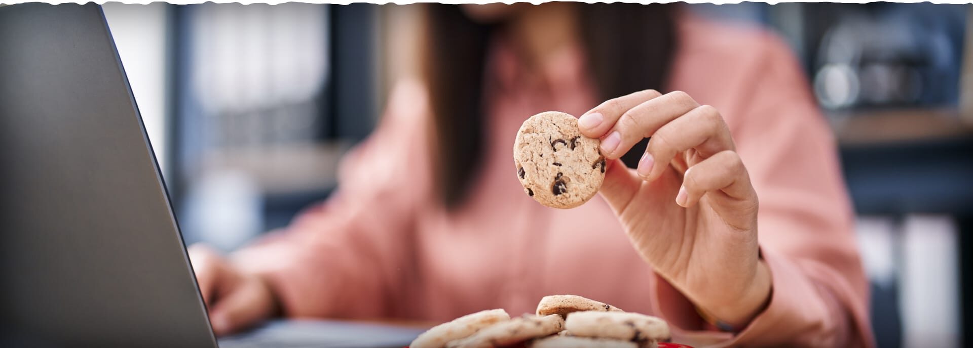 a person working and picking up a cookie